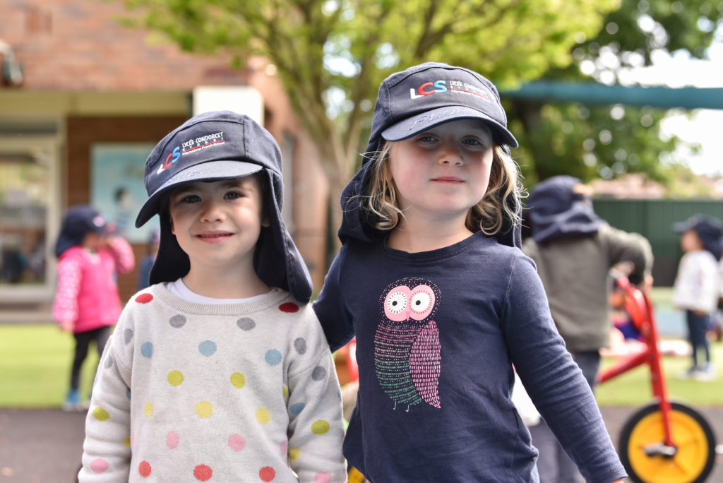 Children in sun safe hats and no uniforms