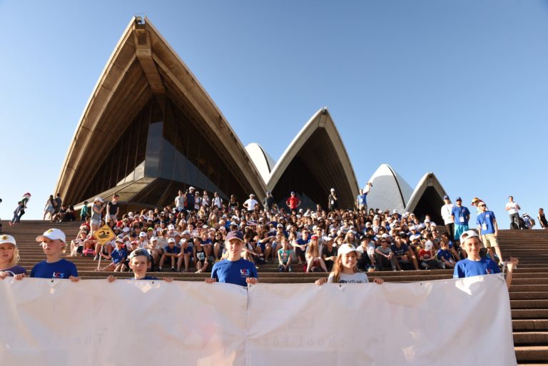 Swimmers in the Asia-Pacific Swimming Competition in front of Sydney Opera House