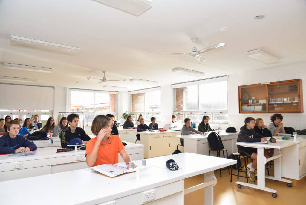 Students working in light and airy classroom