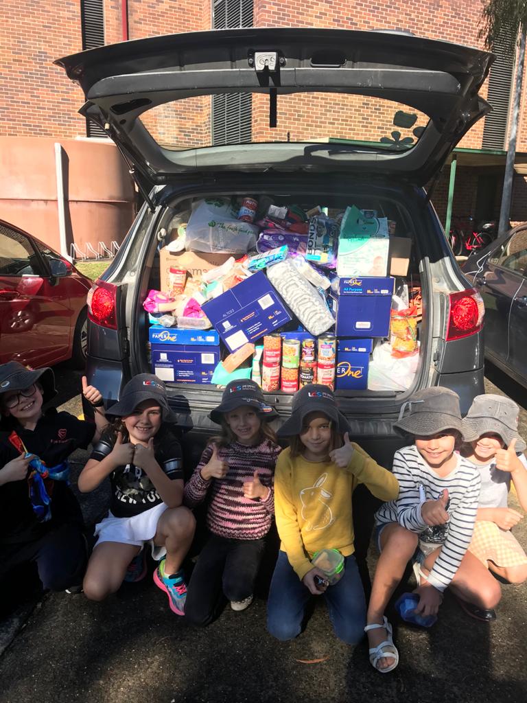 Students with donations for local charity